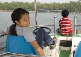 Kids driving our electric boat at Be Hai Park